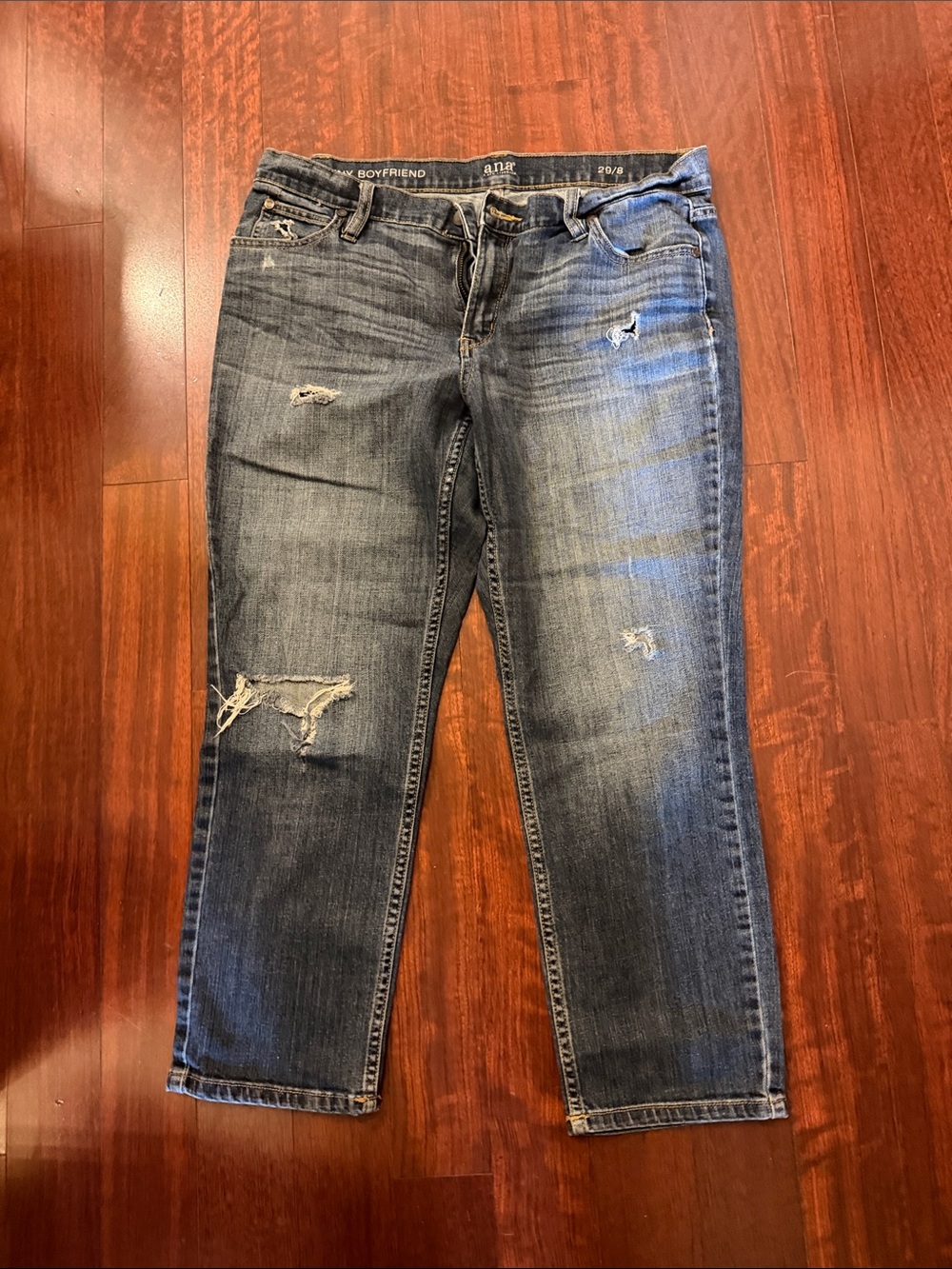 Women’s skinny boyfriend Distressed Blue Jeans.